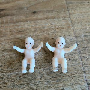 Vintage plastic miniature baby dolls.